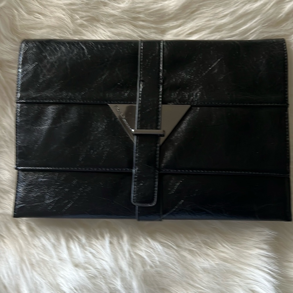 NWT BCBGeneration black clutch, two section w/ essential zip close pocket!
